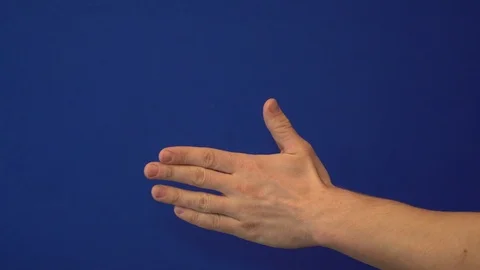 Hand on blue background shows how to split and join your fingers Stock Footage 124304765