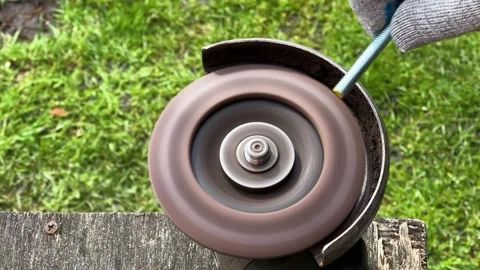 Hand bolt grinding on the angle grinder machine disk. Burning metal sparks Vídeo Stock 243664667