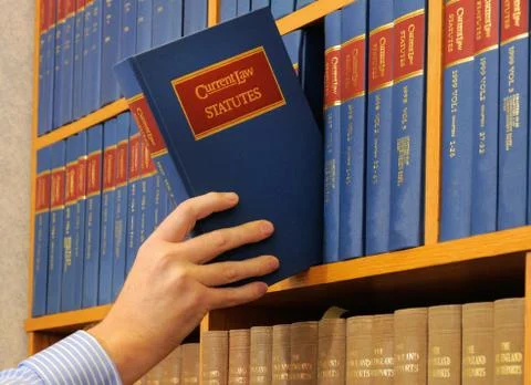 Hand with book Stock Photos