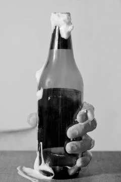 Hand with bottle of beer Stock Photos