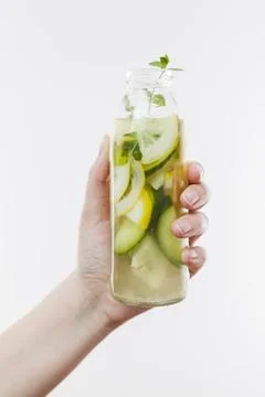 Hand with bottle fruit lemonade. High quality photo hand with bottle fruit... Stock Photos
