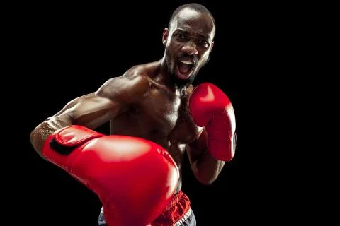 Hand of boxer over black background. Strength, attack and motion concept Stock Photos