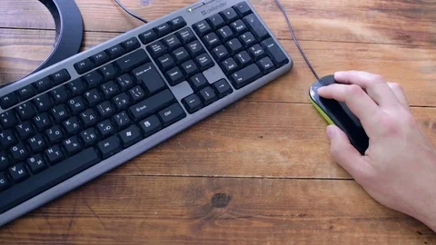 Hand of the boy and a computer mouse. Video stock 82099834