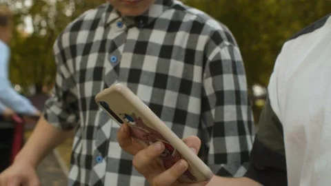 Hand of a boy browsing smart phone Stock Footage 143791382