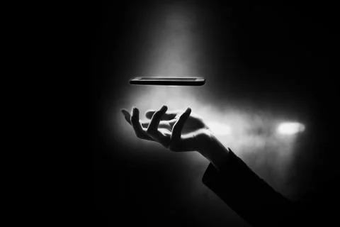 Hand of boy going to catch smart phone, smart phone addiction concept Stock Photos