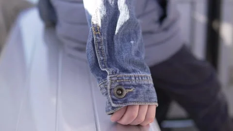 The hand of a boy's child on a bench in the funicular Stock Footage 233767043