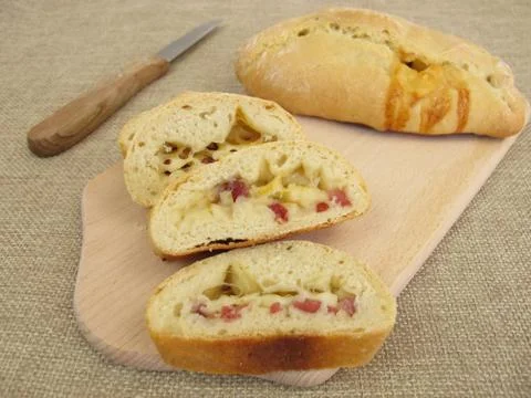 Hand bread street food with cheese and diced ham Stock Photos