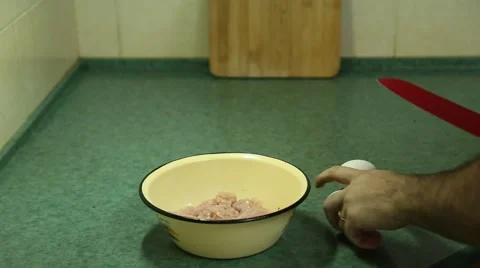 Hand break the eggs in the minced meat Video stock 64959215