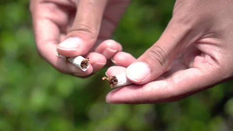 Hand Breaking Cigarette in Half – No Smoking Campaign Concept for World No Tobac Stock Footage 306741446