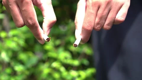 Hand Breaking Cigarette in Half – No Smoking Campaign Concept for World No Tobac Stock Footage 306741450