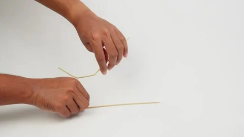 Hand Breaking a Wooden Stick in Close Up Stock Footage 327851853