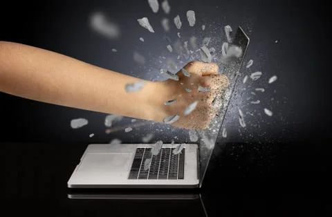 Hand breaks laptop screen 스톡 사진