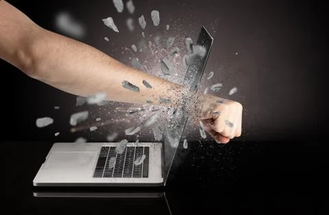 Hand breaks laptop screen Stock Photos