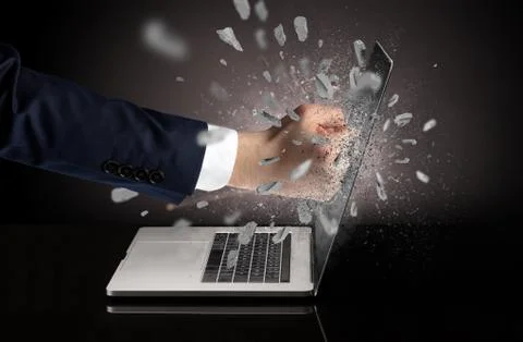 Hand breaks laptop screen Stock Photos