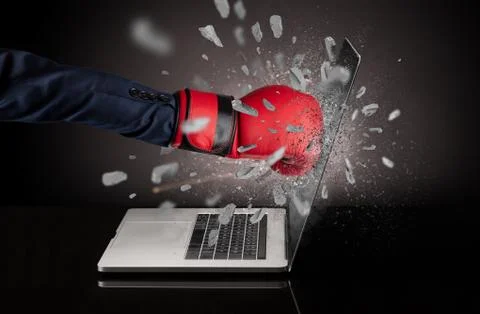 Hand breaks laptop screen Stock Photos