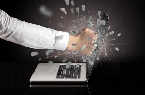 Hand breaks laptop screen 스톡 사진