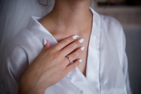 Hand of the bride on the neckline Stock Photos