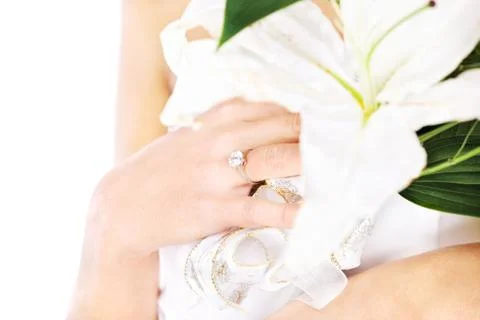 Hand of a bride with ring and flowers Stock Photos
