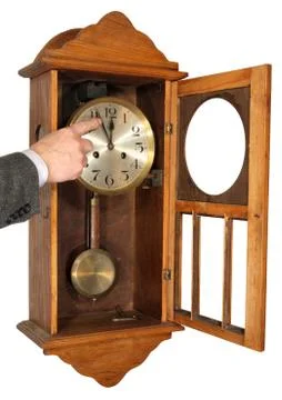 The hand bringing arrows of a wall clock, showing midnight. Stock Photos