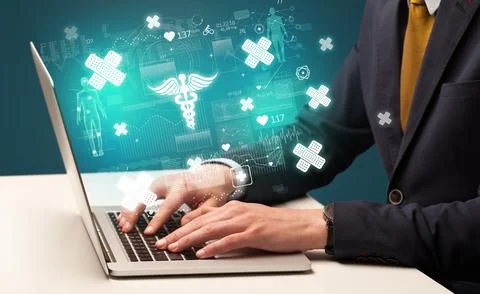 Hand browsing on the internet for medical issues Stock Photos