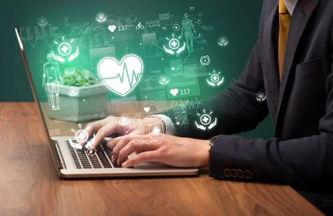 Hand browsing on the internet for medical issues Stock Photos