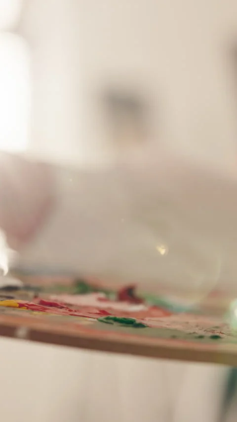 Hand, brush and mix paint with palette to create different color, artist project Stock Footage 346201204
