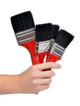 Hand with a brushes Stock Photos