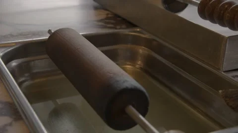 Hand Brushing Liquid on Baking Cylinder in Cafe Kitchen, Sydney, Australia Stock Footage 345657973