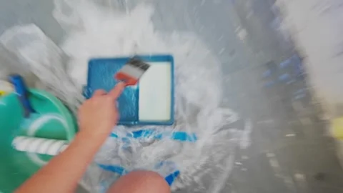 Hand brushing primer onto interior wall during room renovation Stock Footage 335315905