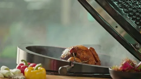 Hand brushing roasted whole chicken on a the grill bbq barbeque kamado camado Video stock 292808750