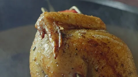 Hand brushing roasted whole chicken on a the grill bbq barbeque kamado camado Video stock 292811720