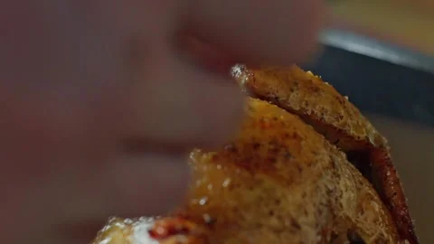 Hand brushing roasted whole chicken on a the grill bbq barbeque kamado camado Video stock 292812252