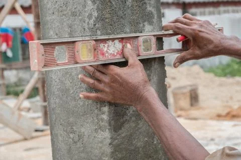 Hand with bubble level Stock Photos