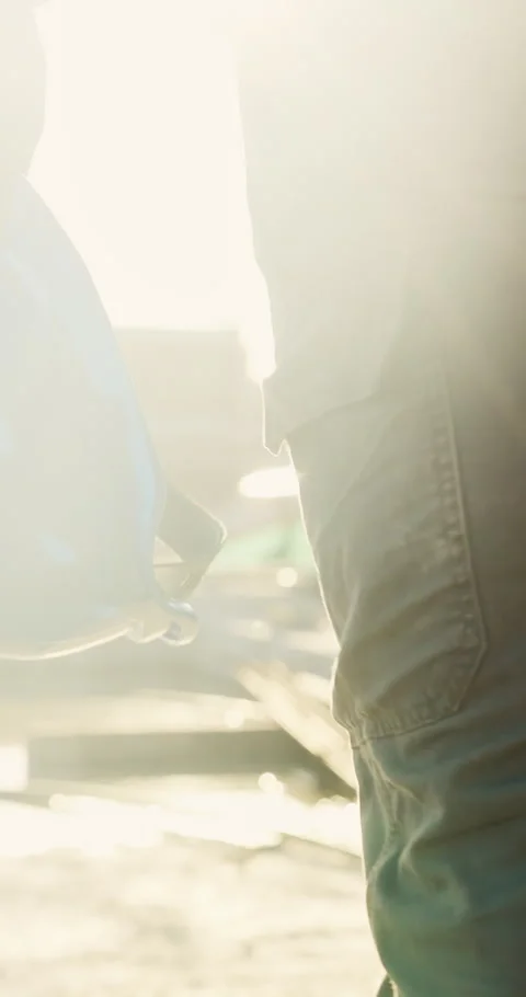 Hand, builder and walk with helmet at construction site for safety or Stock Footage 336792984