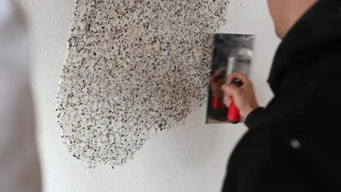 Hand of builder worker plastering at wall Stock Footage 168910665