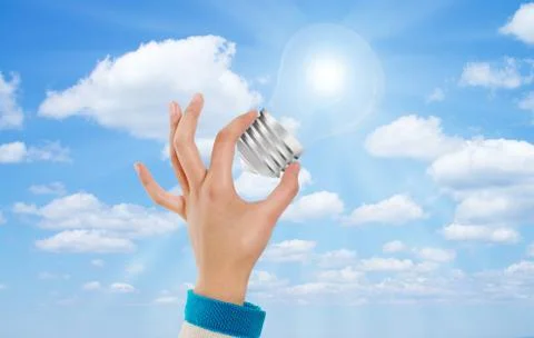 Hand bulb sky Stock Photos