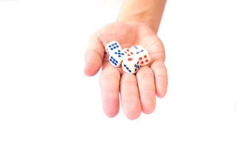 A hand with a bunch of dice Stock Photos
