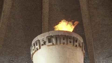 A hand with a burning torch, an eternal flame in memory. Volgograd, Russia Stock Footage 87466433