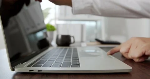 Hand of business man open notebook and using laptop Stock Footage 139426875