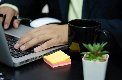 Hand business man is typing on a computer keyboard. Stock Photos