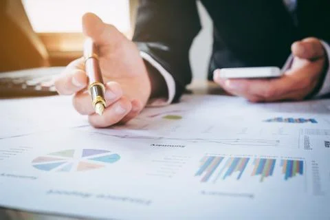 Hand of business man working document and laptop in office morning light. b.. Stock Photos