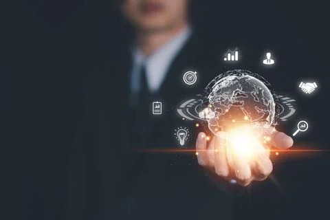 Hand of Businessman hold virtual global with hologram using metaverse and i.. Stock Photos