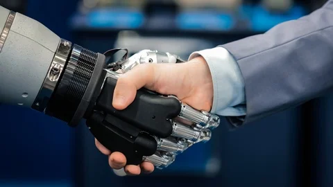 Hand of a businessman shaking hands with a Android robot. Stock Footage