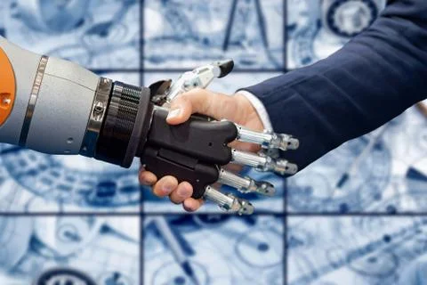 Hand of a businessman shaking hands with a Android robot. Stock Photos