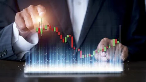 Hand of businessman use tablet analysis stock market graph growth and increas Stock Photos