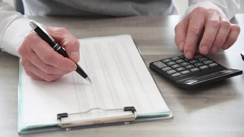 Hand of businessman using calculator Stock Footage 108968842