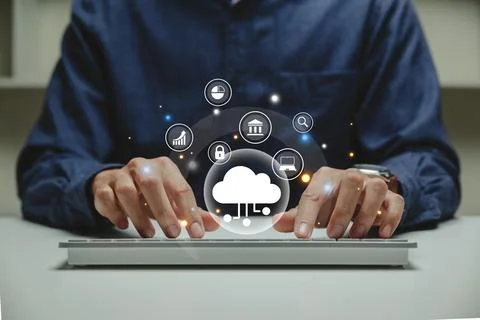 Hand of businessman using computer with cloud computing icons. 写真素材