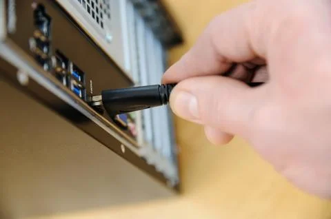 The hand with cable plug HDMI. Stock Photos