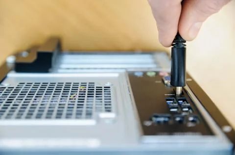 The hand with cable plug HDMI. Stock Photos