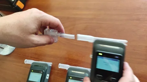 Hand is calibrating alcometers one by one Video stock 245923873